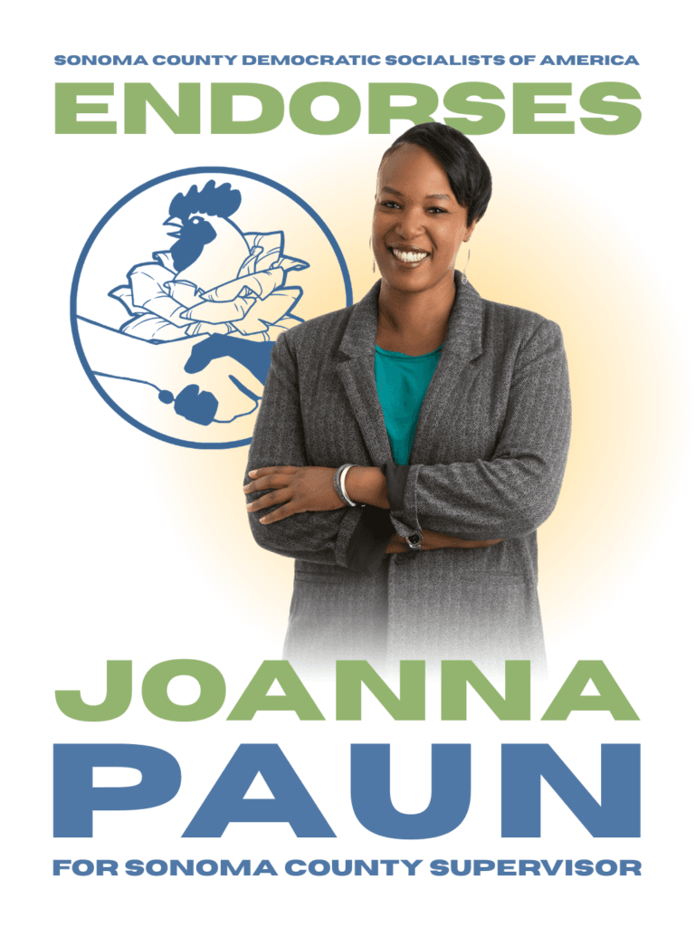 Sonoma County Democratic Socialists of America endorses Joanna Paun for Sonoma County Supervisor [Pictured: Joanna Paun, a Black woman with short, sideswept black hair wearing a blazer, smiles in front of our logo while crossing her arms.]